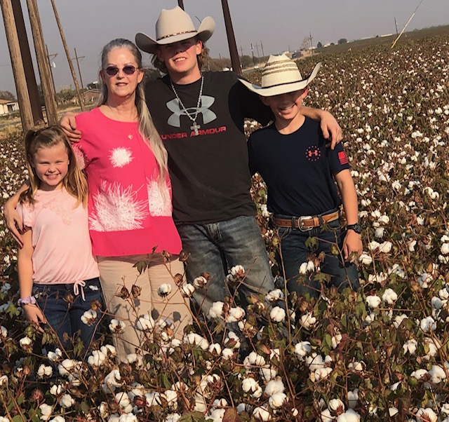 Memaw and kids in cotton field
