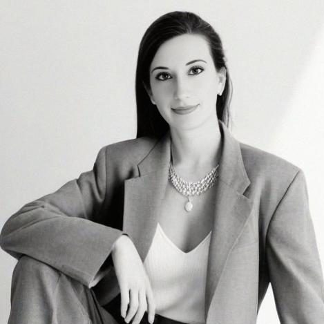 Image of Linda Kozar with a book shelf in background
