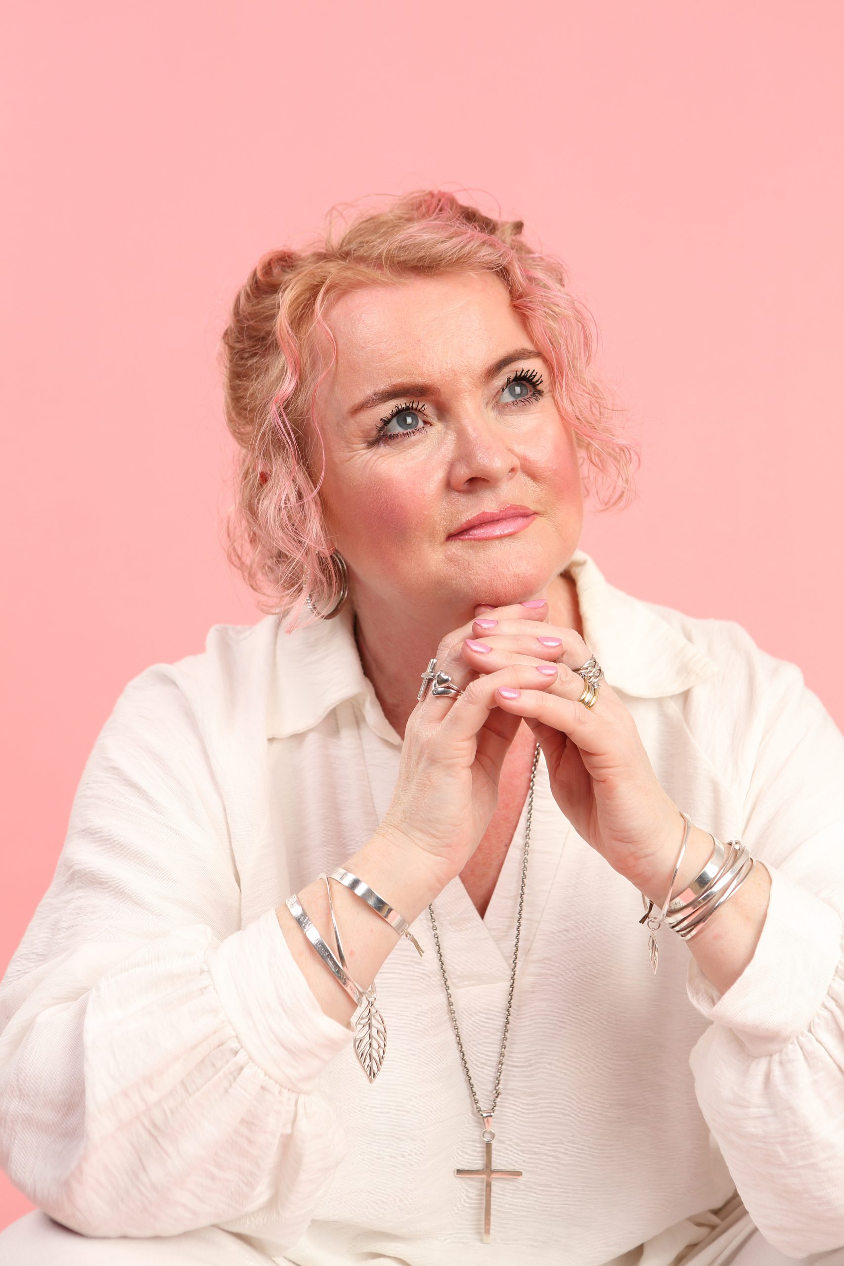 Image of Linda Kozar with a book shelf in background