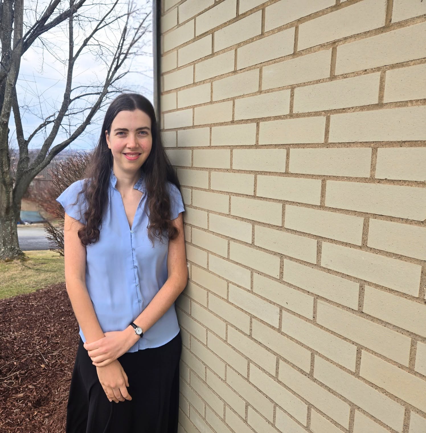 Lauren next to brick wall